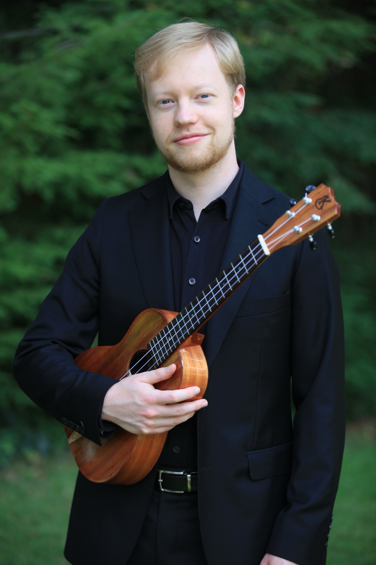 Calder Sprinkle holding a koa ’ukulele